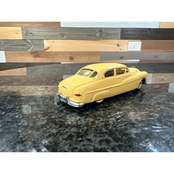 1:43 EMPIRE ZAUGG MODEL TIN WIZARD 6 MERCURY 51 1951 YELLOW